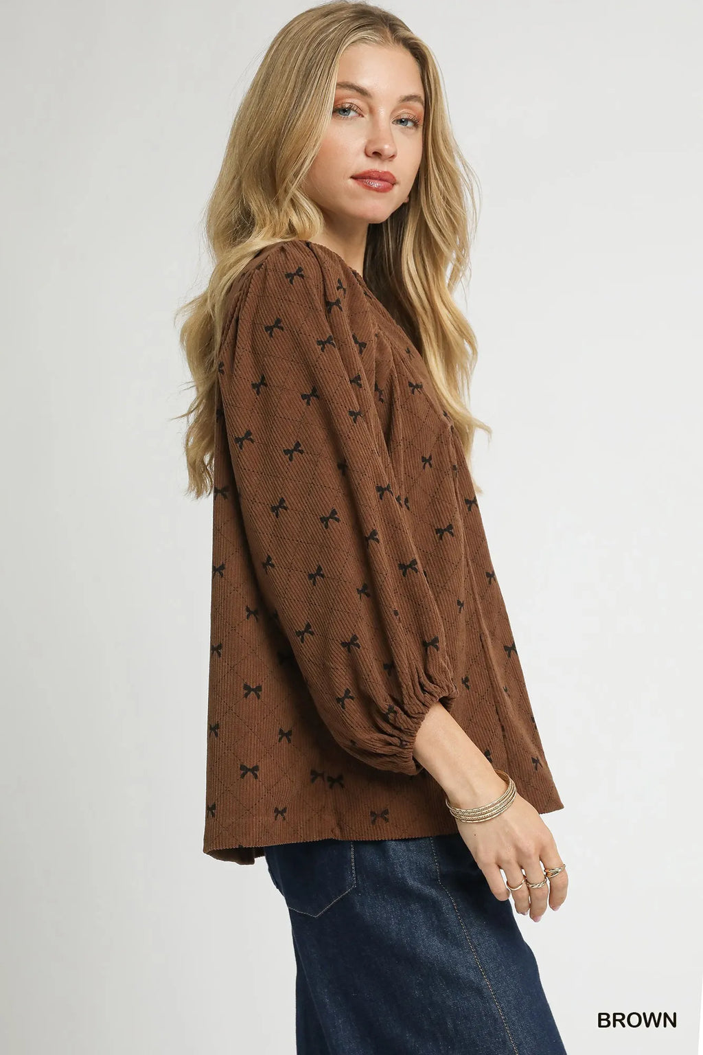 Brown corduroy bow-print blouse, balloon sleeves and V-neck with gathered hem