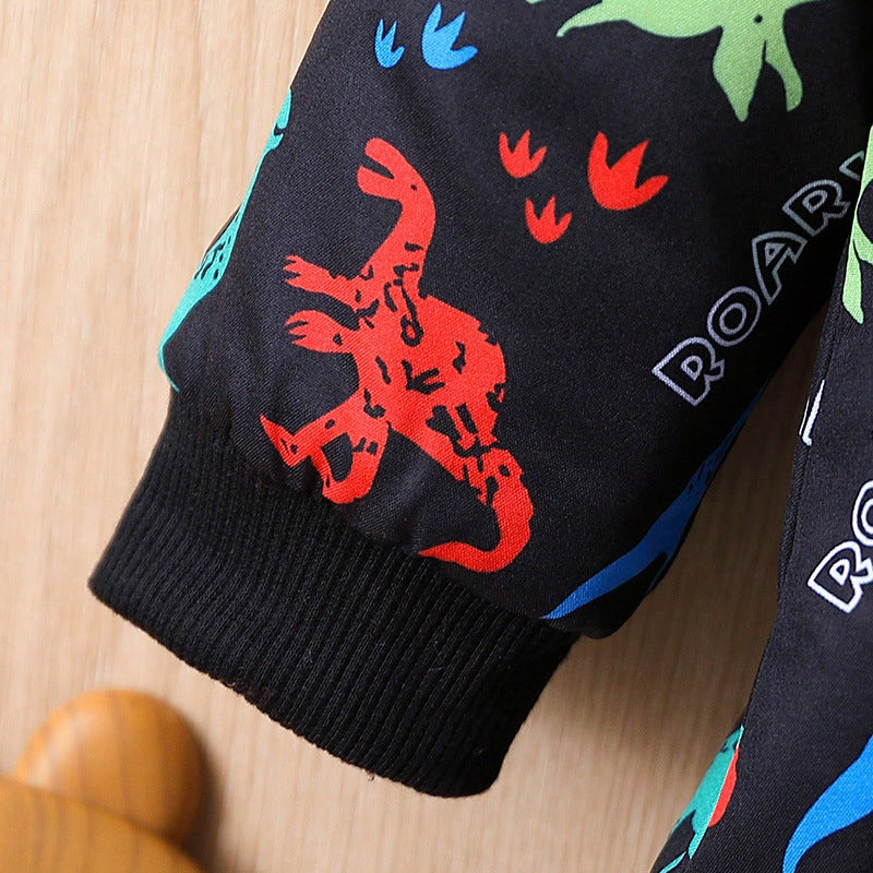 Ribbed black cuff hem on a black dinosaur coat with bright red and blue dinosaur print