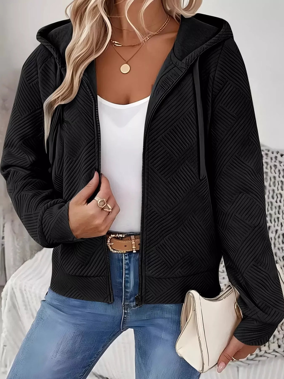 Black textured zip-up hooded jacket with geometric pattern, front zipper and pockets