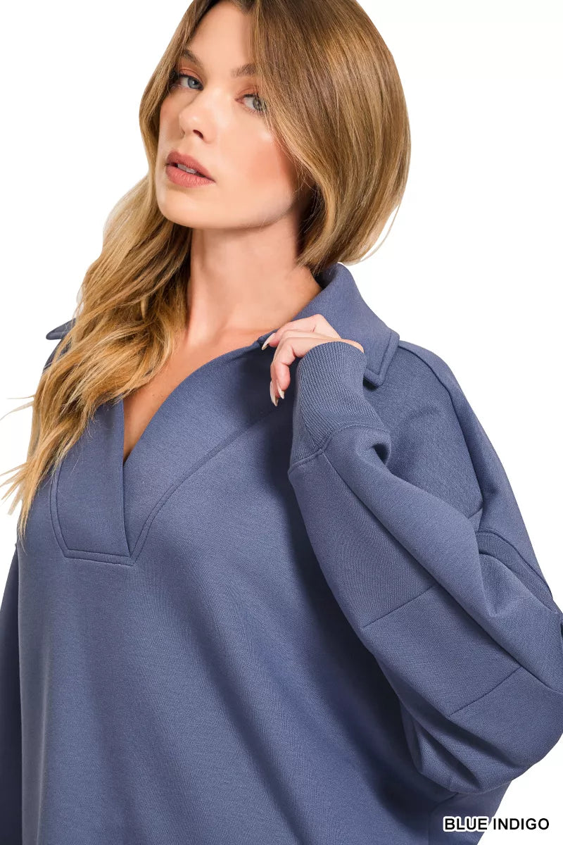 Blue indigo collared pullover close-up with structured seam details