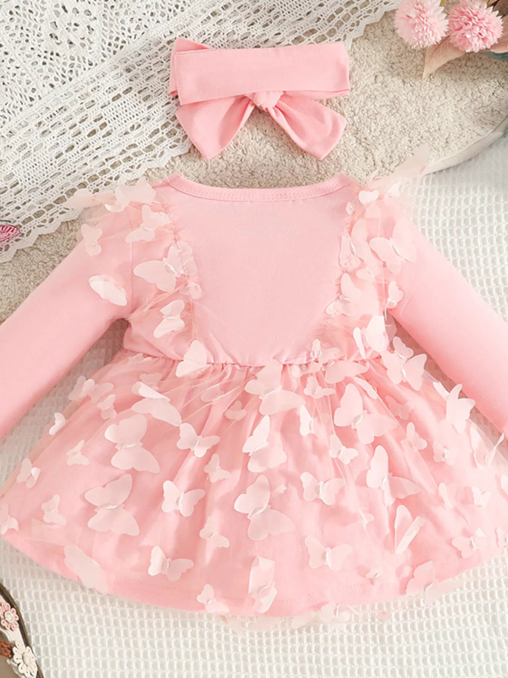 Pink dress with layered butterfly flower appliques and wide bow headband