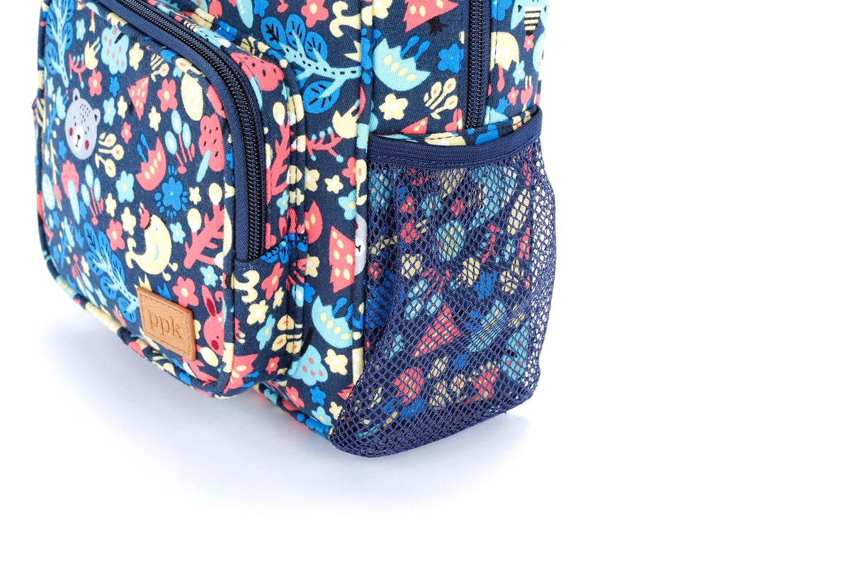Navy mini backpack corner view with mesh side pocket and zip front