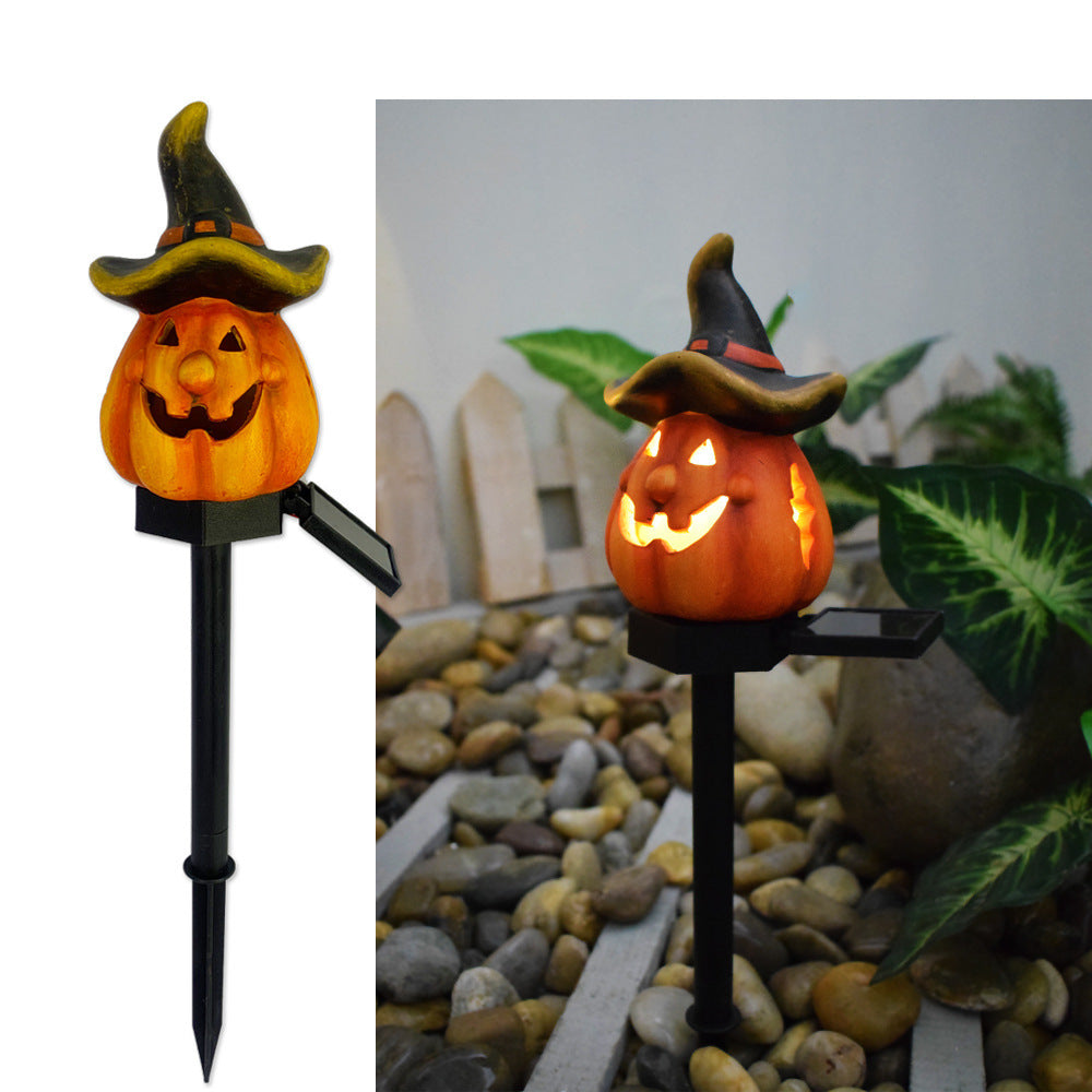 Solar Halloween pumpkin lantern stake light with orange jack-o’-lantern and green witch hat