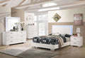 White high-gloss bedroom set with bed, dresser, and matching nightstands