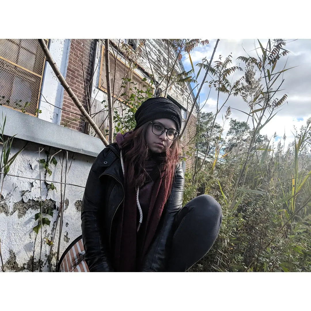 Black slouch beanie hat with textured knit and small logo patch