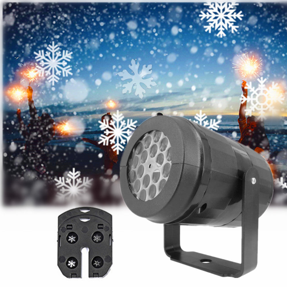 Black LED snowflake projector light aiming at a snowy scene with glowing snowflakes