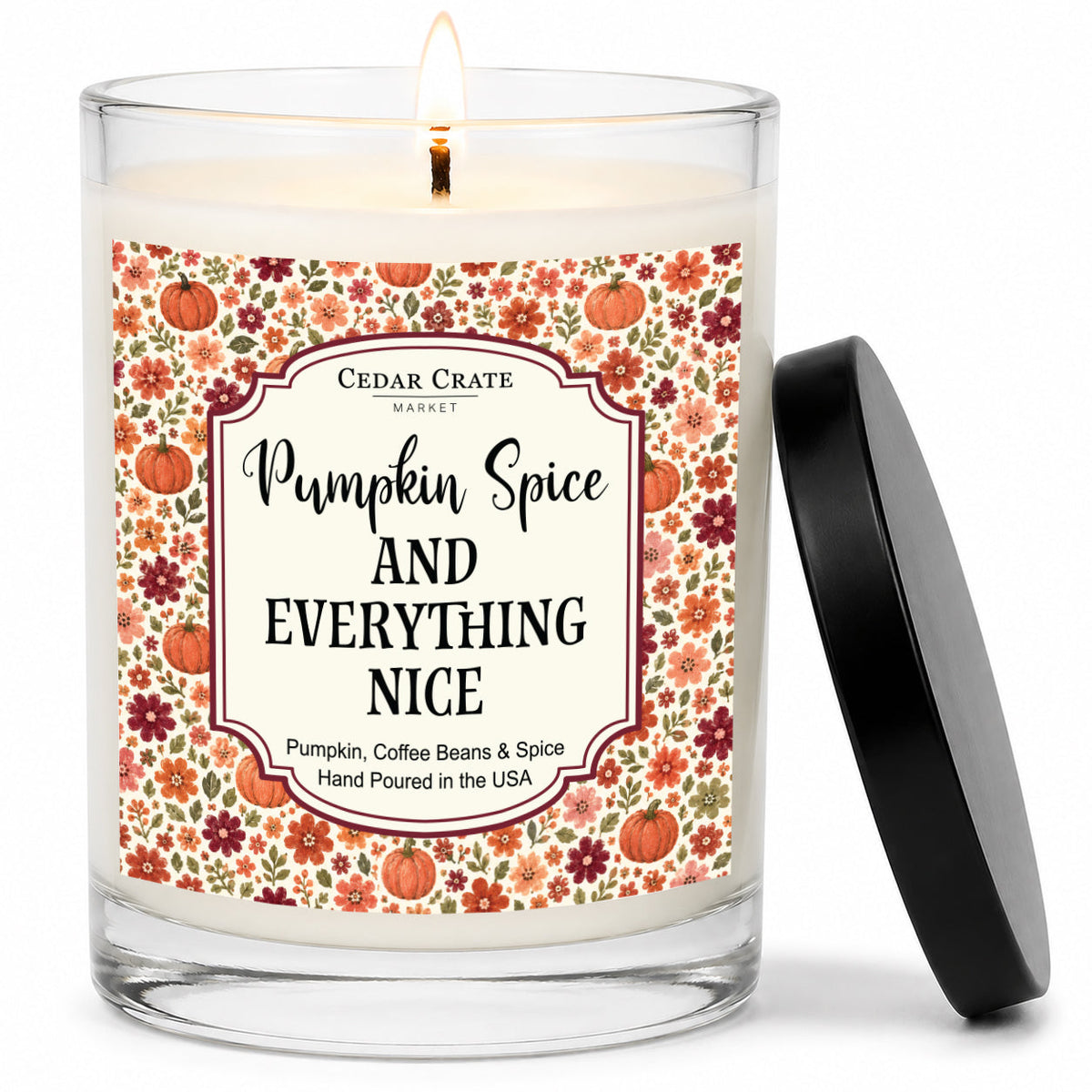 Pumpkin Spice and Everything Nice candle in clear glass jar with floral label.