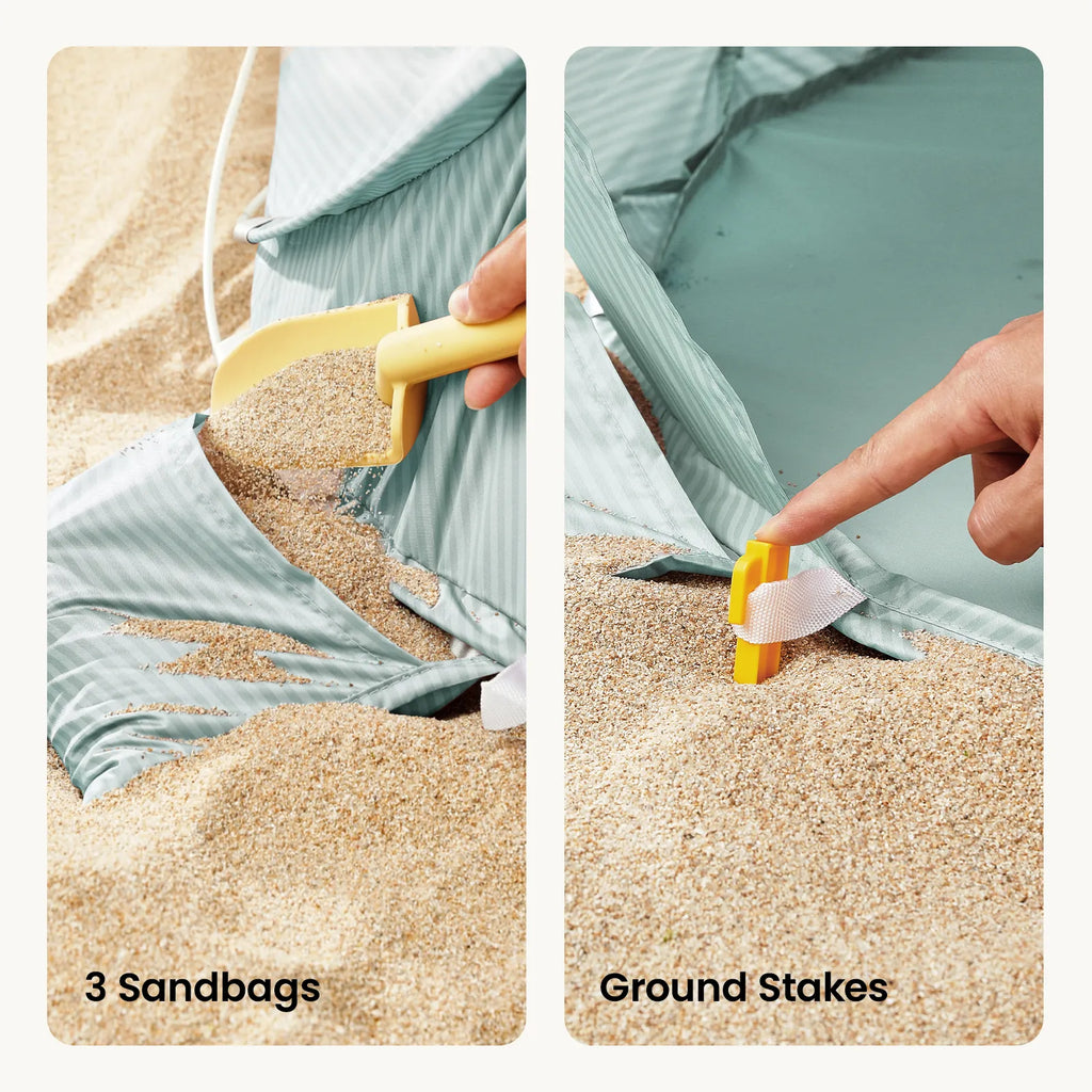 Baby beach tent corner with ground stakes and sandbags securing the base