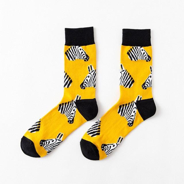 Yellow crew socks with black zebra illustrations and black toe/heel