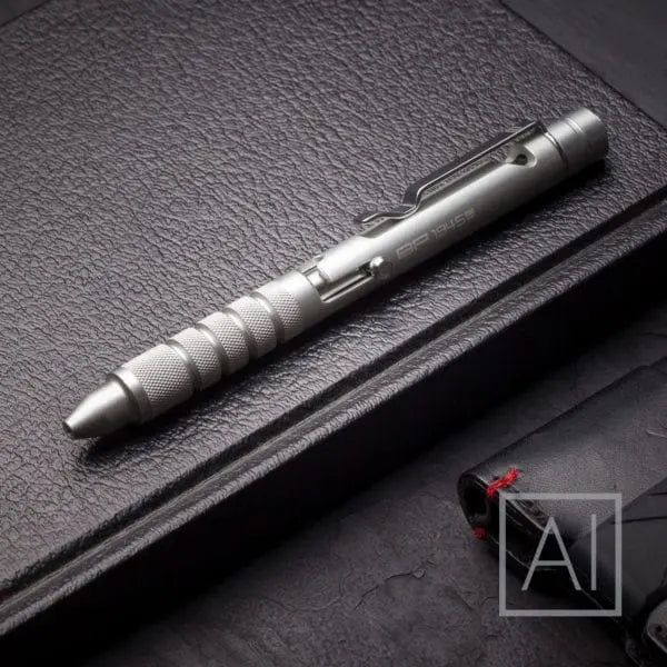 Light silver bolt-action EDC pen with clip on leather case