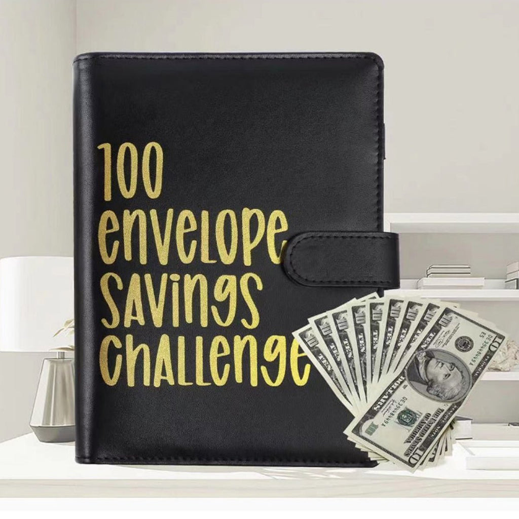 Black envelope savings challenge binder with snap strap, surrounded by US dollar bills.