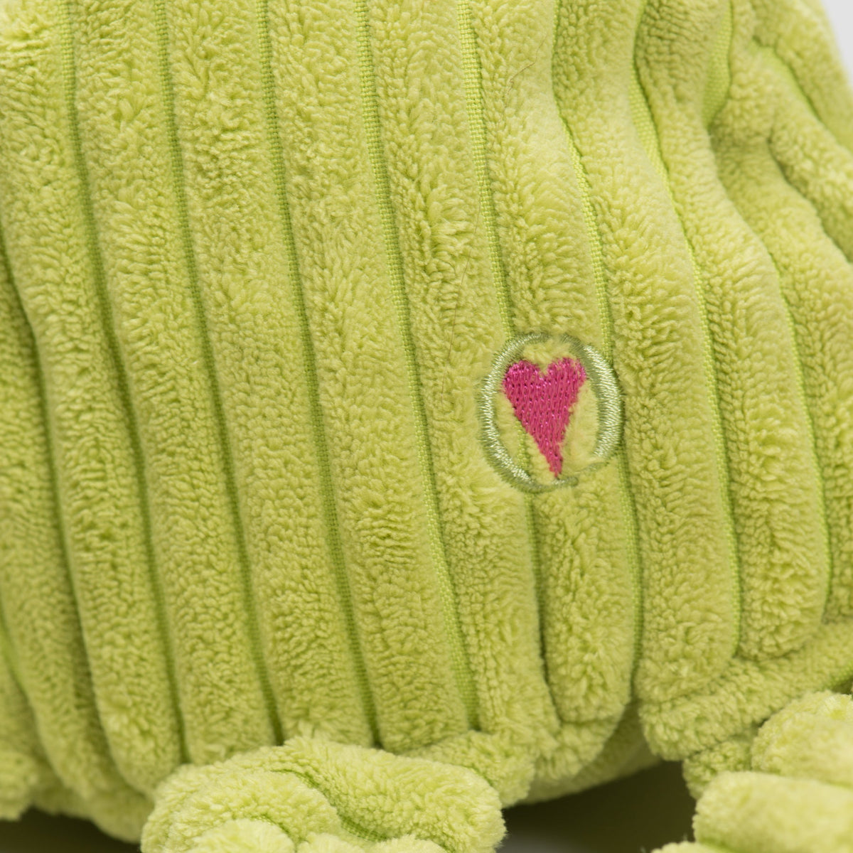 Lime green plush octopus tail section with small embroidered heart patch