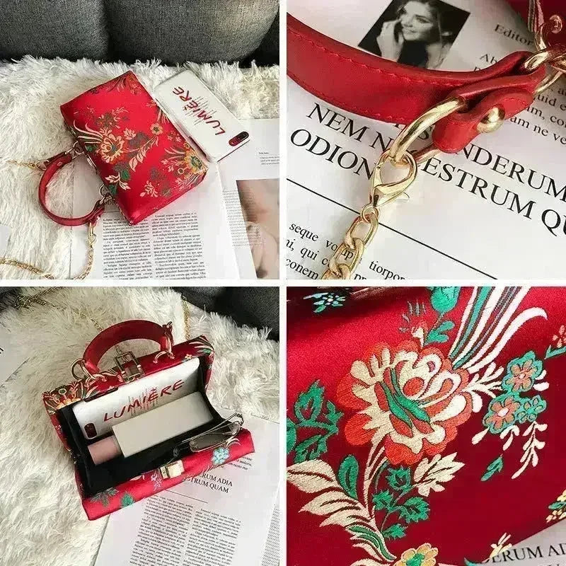 Red floral clutch bag with gold-tone frame clasp and rounded top handle