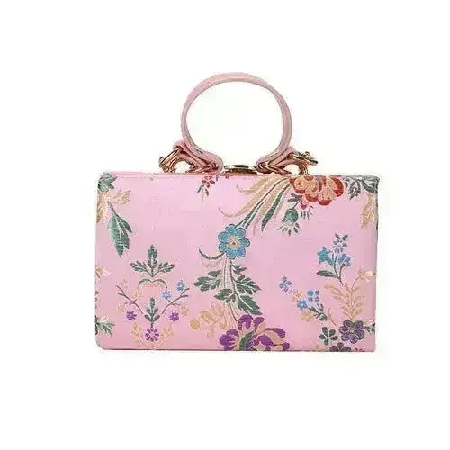 Antique floral frame clutch with top handle, pale pink fabric with purple and blue flowers