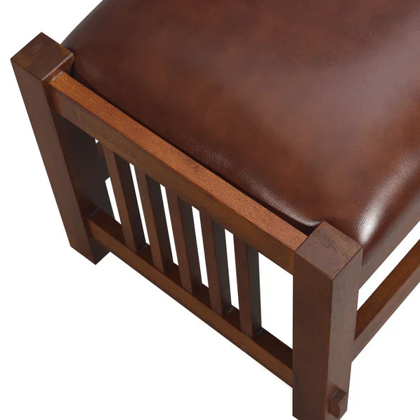 Close-up of chestnut leather ottoman stool armrest-style wood frame and slats