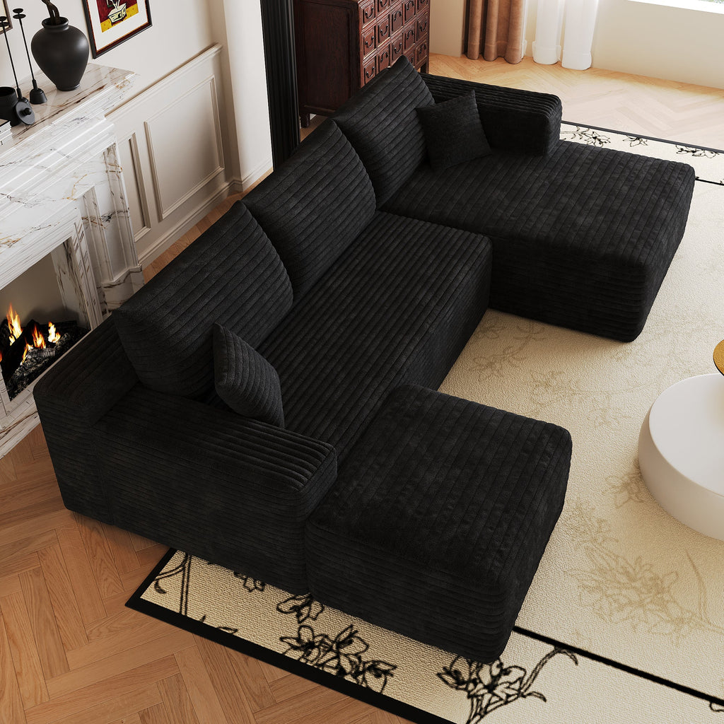Dark L-shaped sectional sofa, close view of chaise and back cushions.