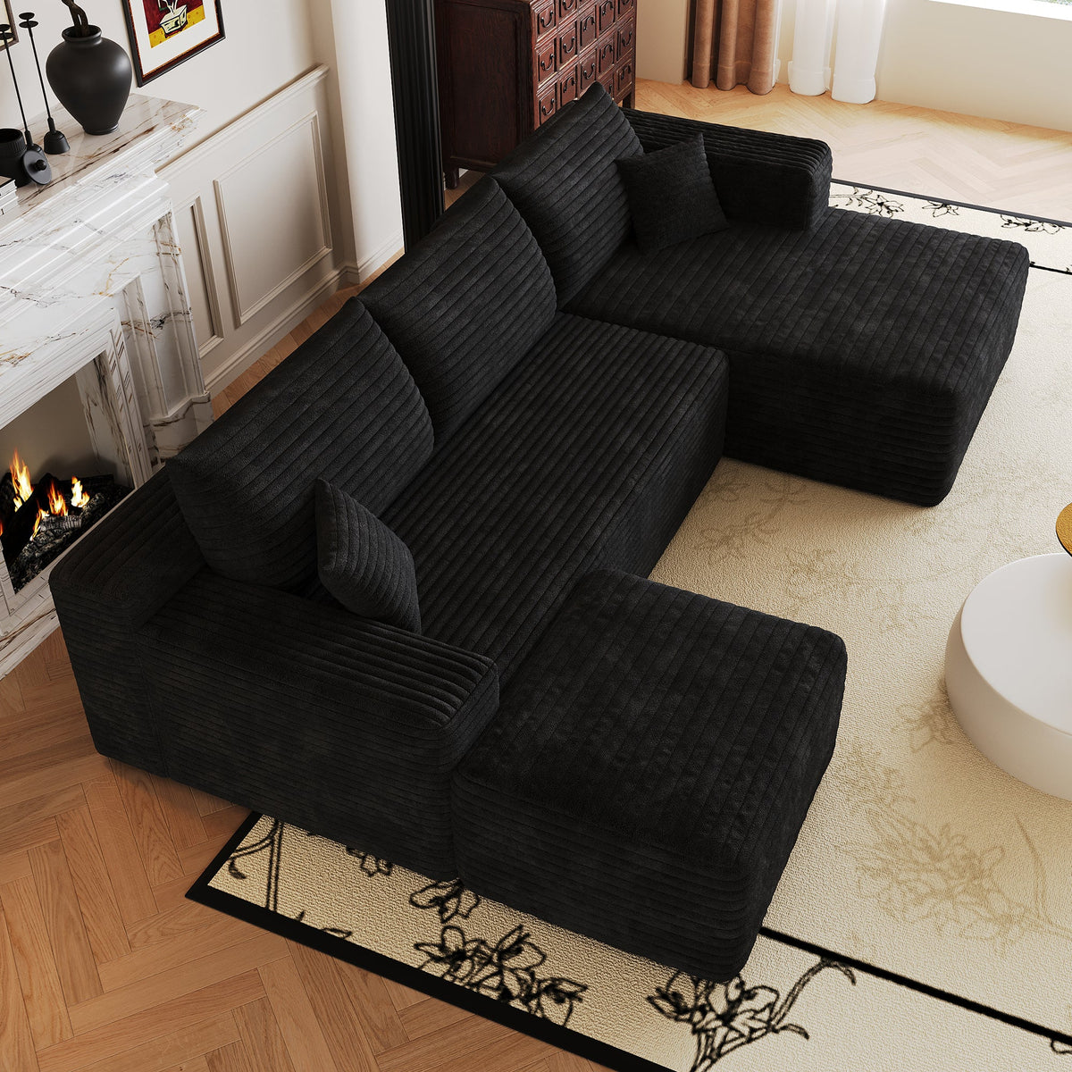 Dark L-shaped sectional sofa, close view of chaise and back cushions.