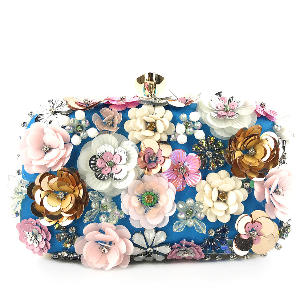 Colorful floral sequin clutch purse front view with gold frame clasp and chain strap