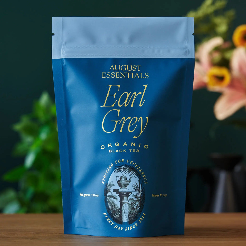 Earl Grey tea pouch, dark blue bag with light blue top and gold label