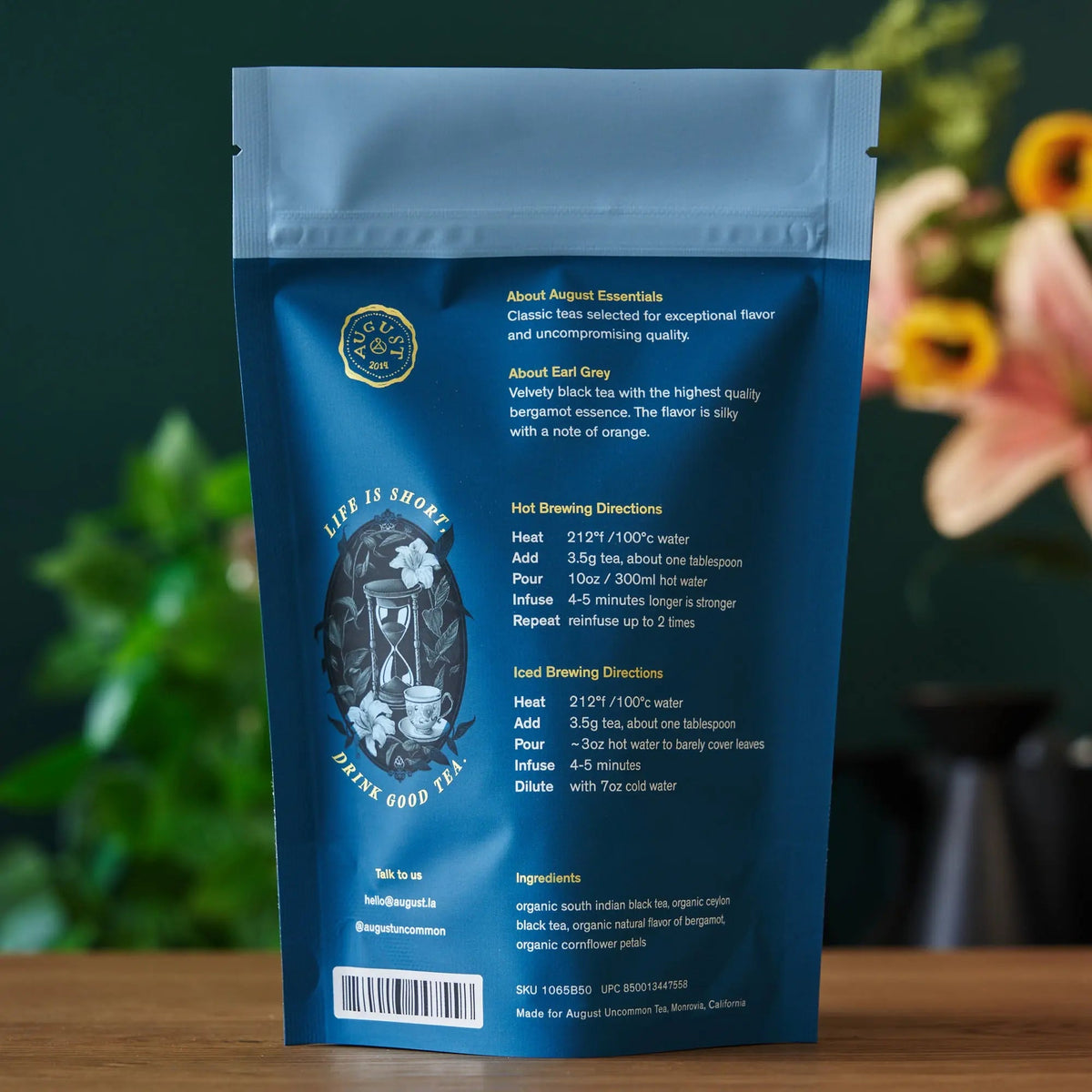 Earl Grey tea pouch back, dark blue bag with brewing directions text and icons