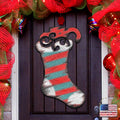 Red, teal, and silver striped Christmas stocking door decor with curled swirled top