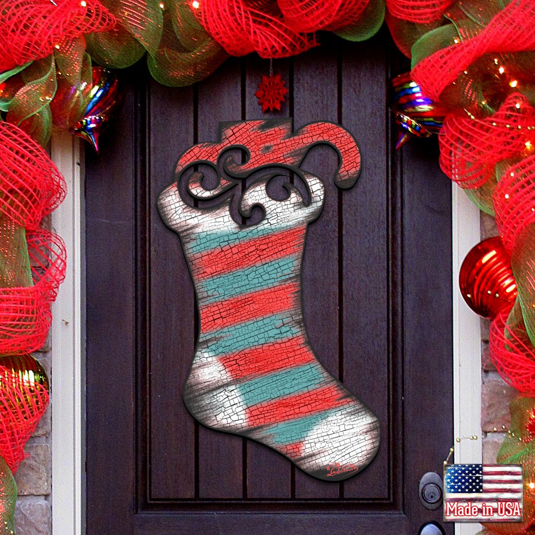 Red, teal, and silver striped Christmas stocking door decor with curled swirled top