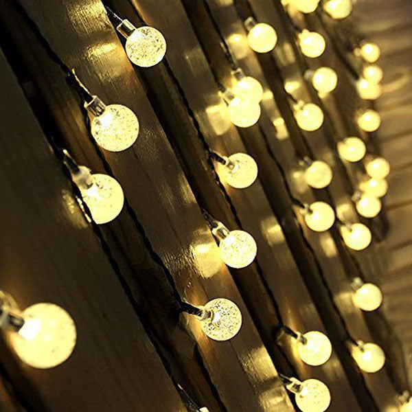 Outdoor solar fairy light string with round globe bulbs and black wire, warm white