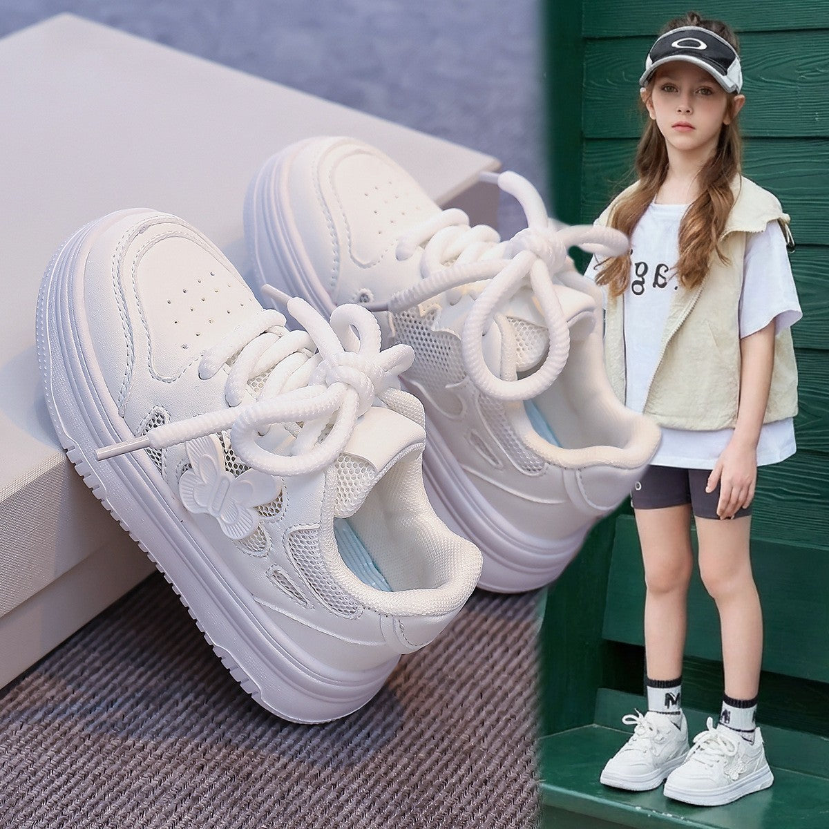 White kids' lace-up skate sneakers with mesh panels and chunky sole, shown in pair.