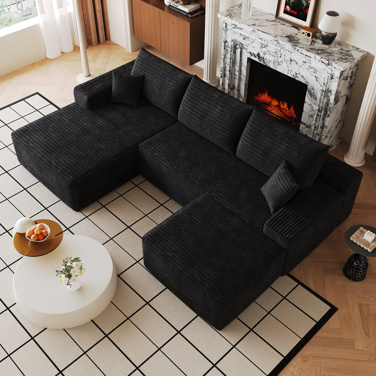 Black U-shaped sectional sofa with corner chaise and ottoman, side view