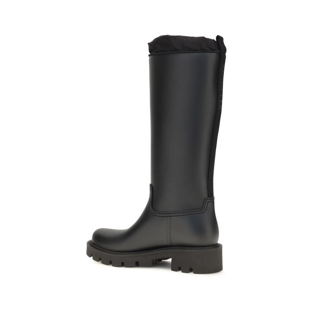 Black mid-calf PVC rain boots with pull-on shaft, stitched panel and chunky tread sole