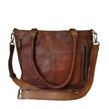 Terry tote bag in brown leather with dual straps, top zipper, and front zip pockets