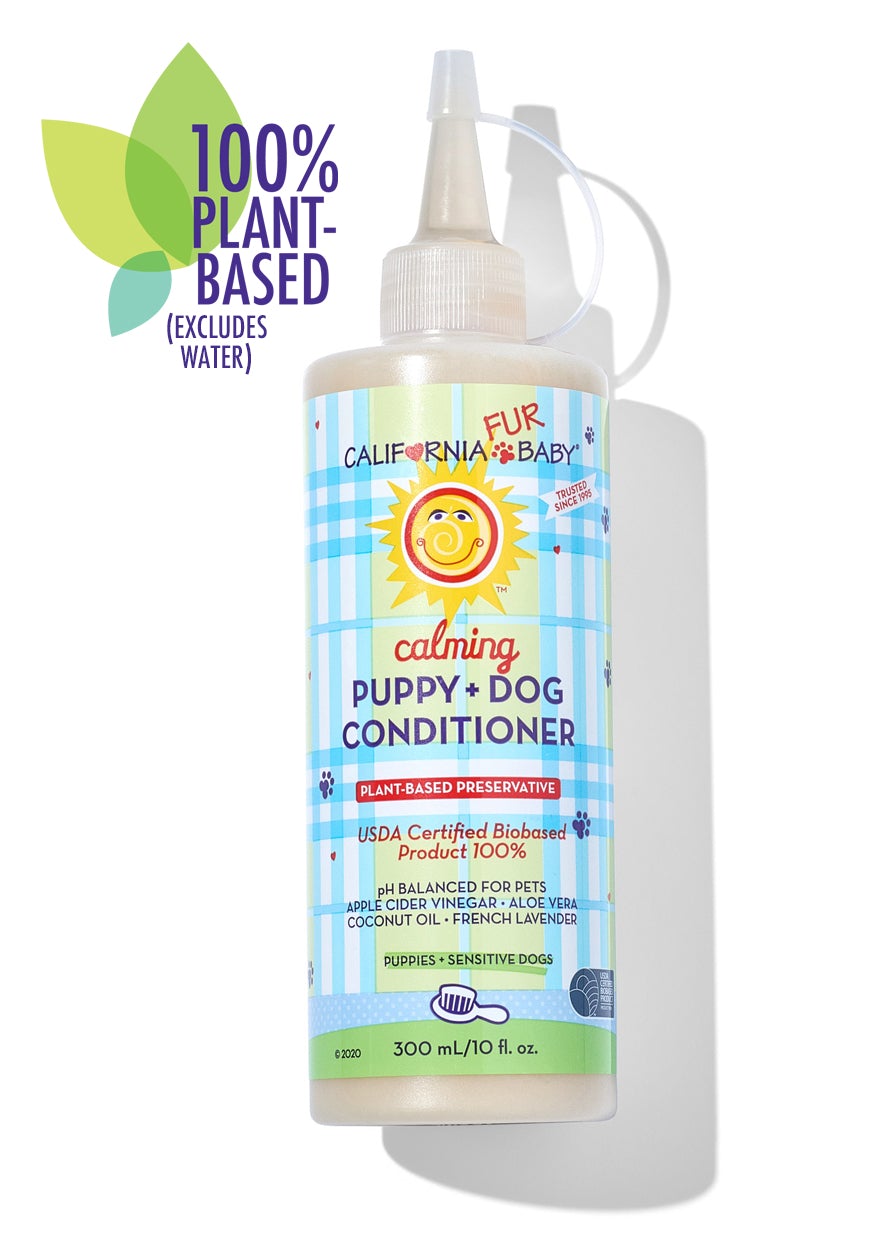 Calming™ puppy and dog conditioner bottle with pump, front label and blue stripe