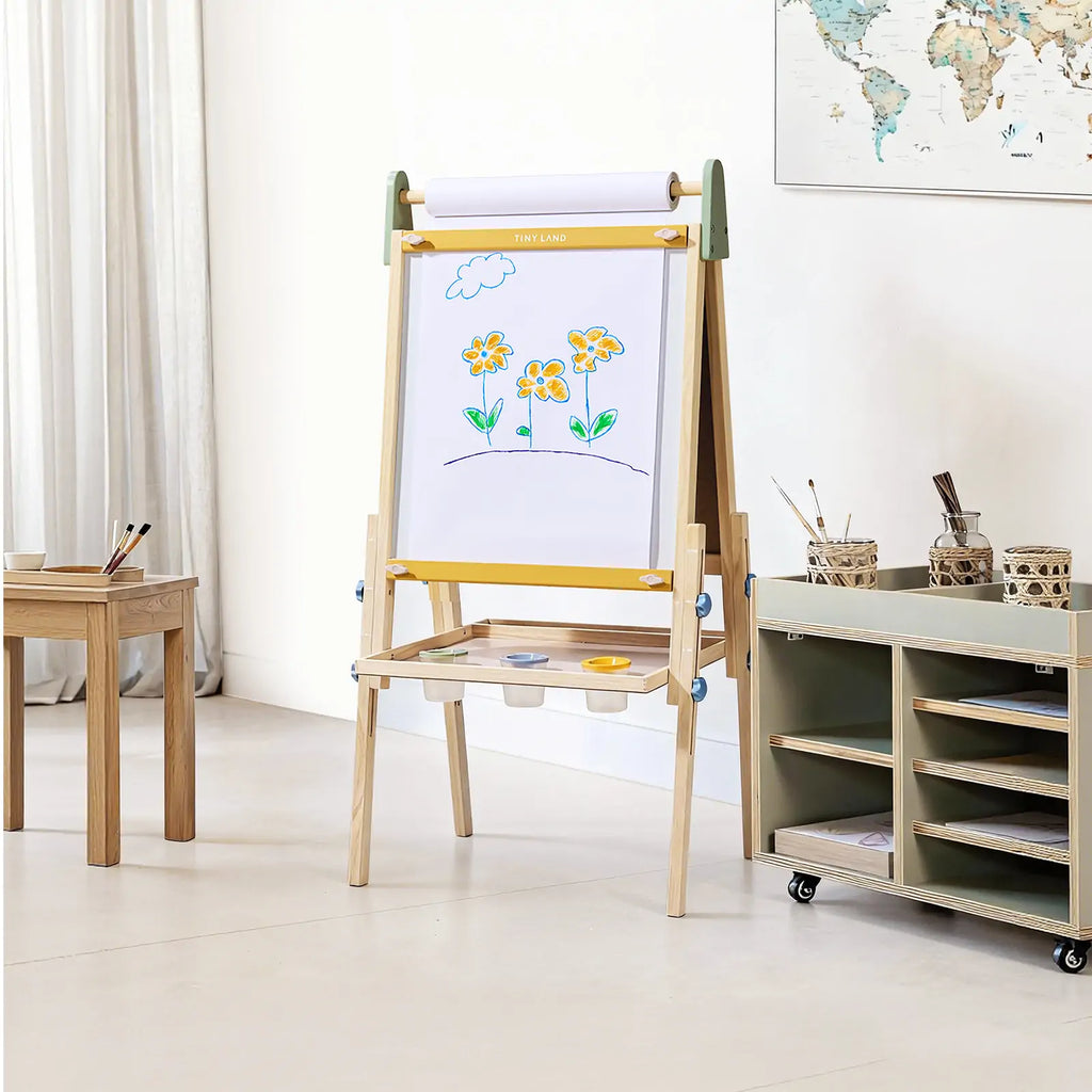 Kids art easel with chalkboard, white paper roll, and color tray shelf