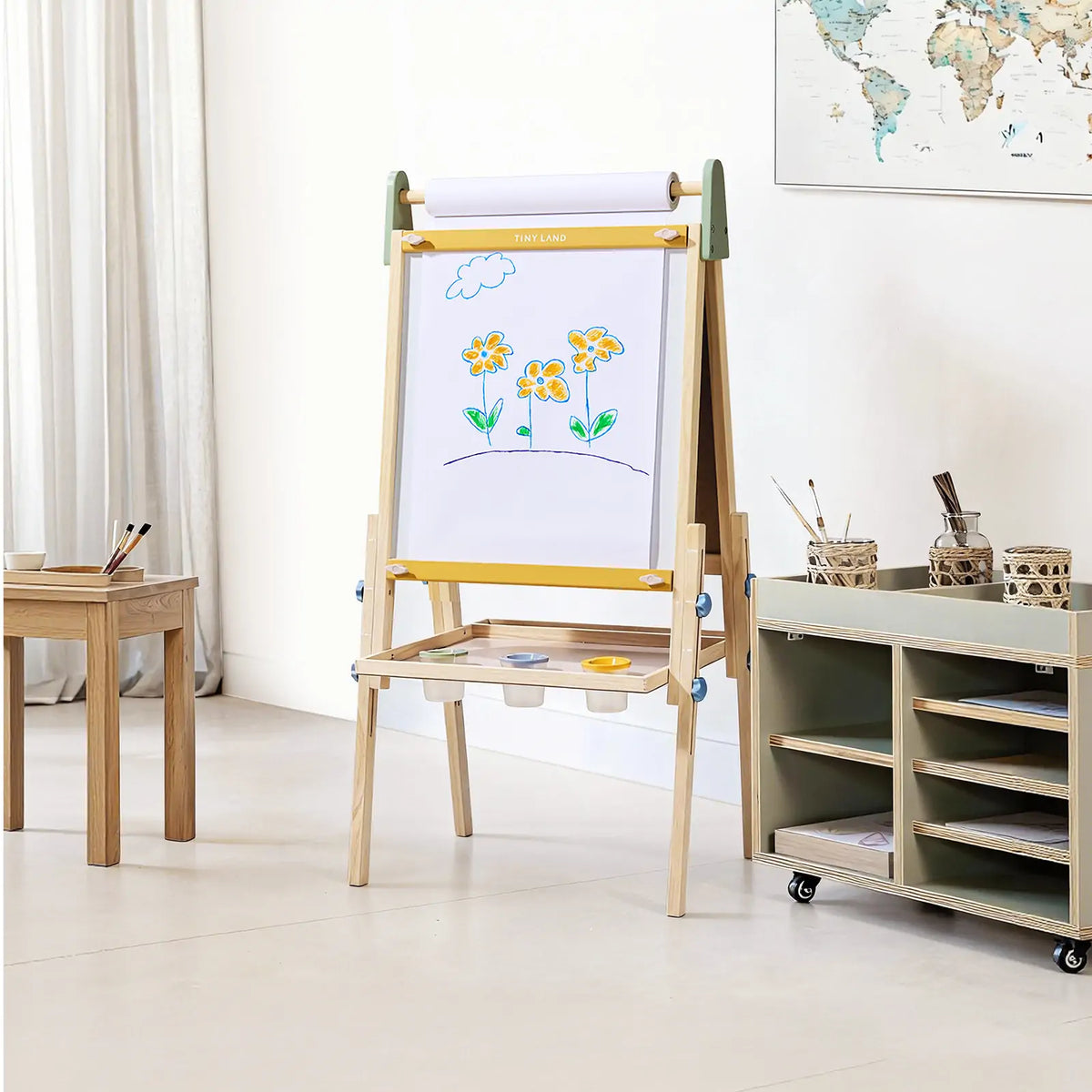 Kids art easel with chalkboard, white paper roll, and color tray shelf