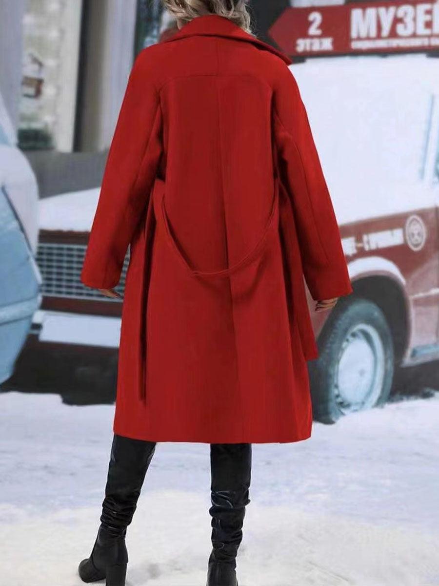 Women’s red long trench coat back view with belt tie and structured collar