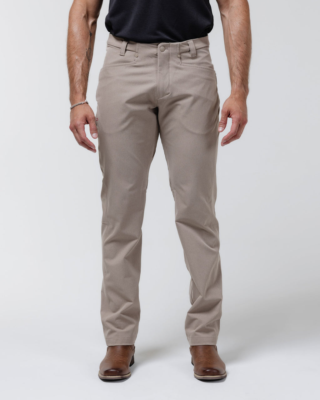 Tan chino pants with button-front closure and belt loops