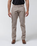 Tan chino pants with button-front closure and belt loops