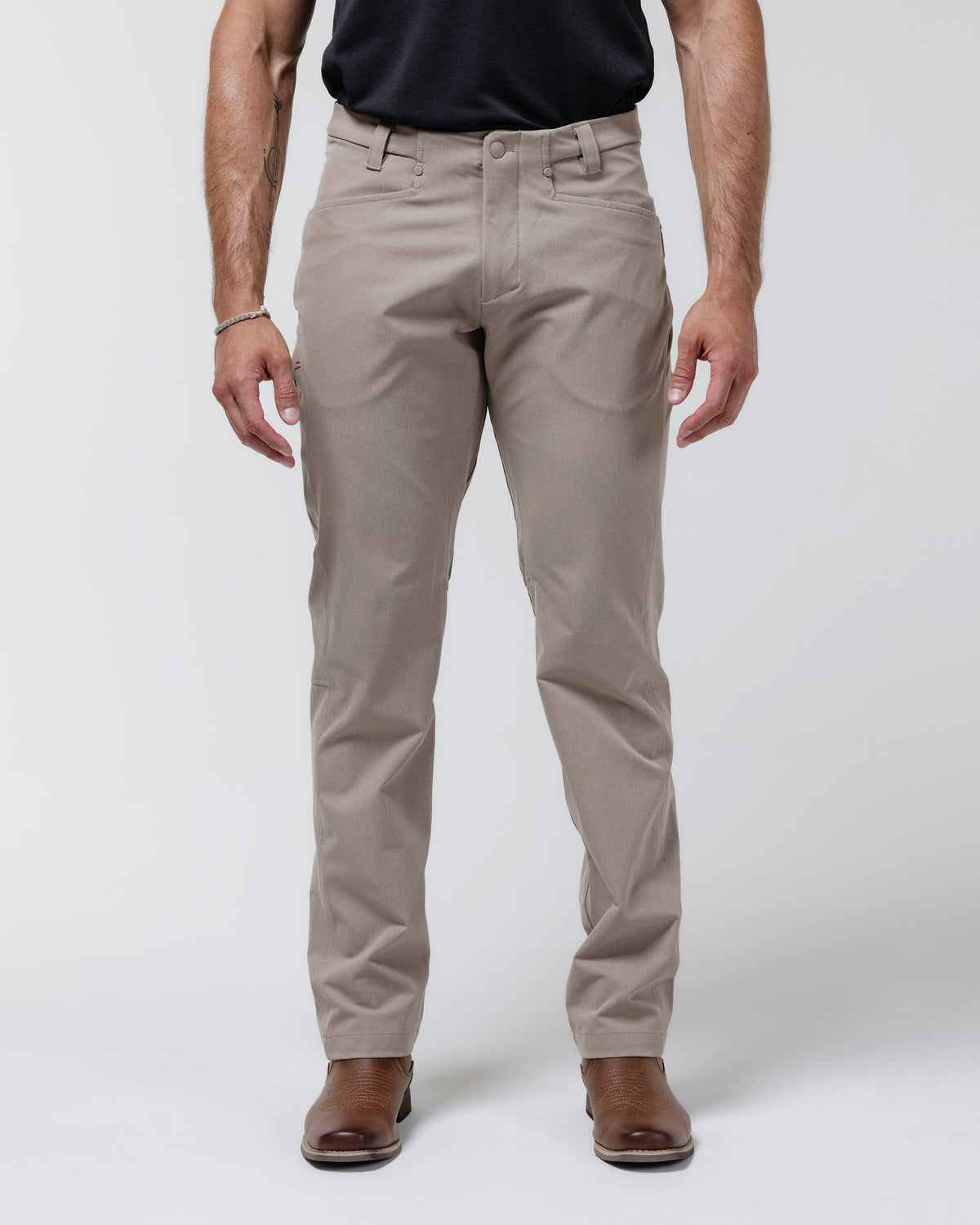 Tan chino pants with button-front closure and belt loops