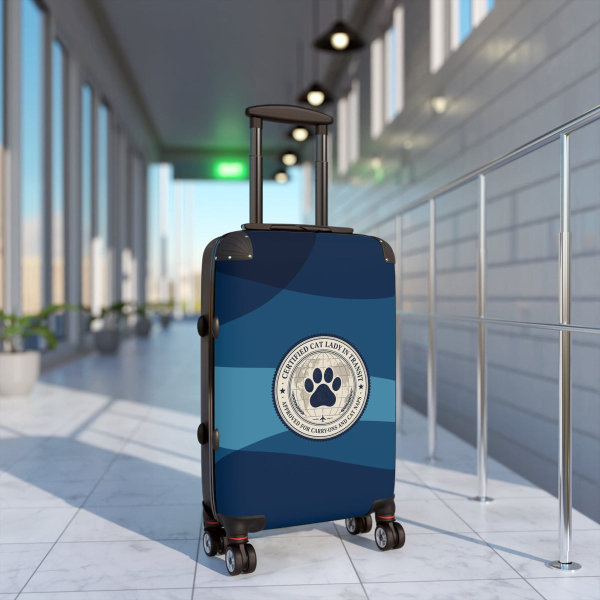 Hard-shell suitcase with circular paw emblem, blue-and-dark striped shell, spinner wheels