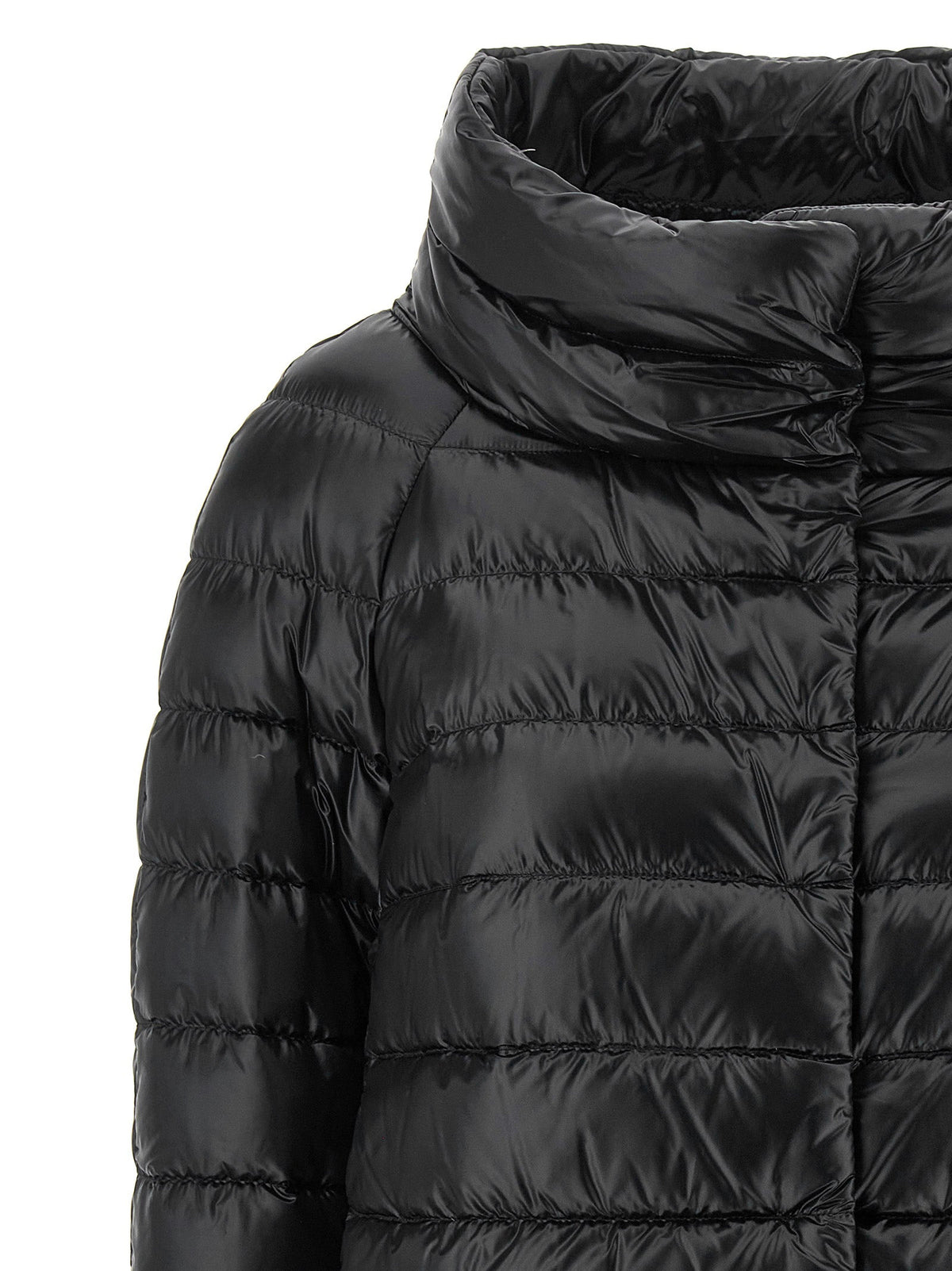 Women’s black puffer jacket close-up of high collar and quilted shoulders