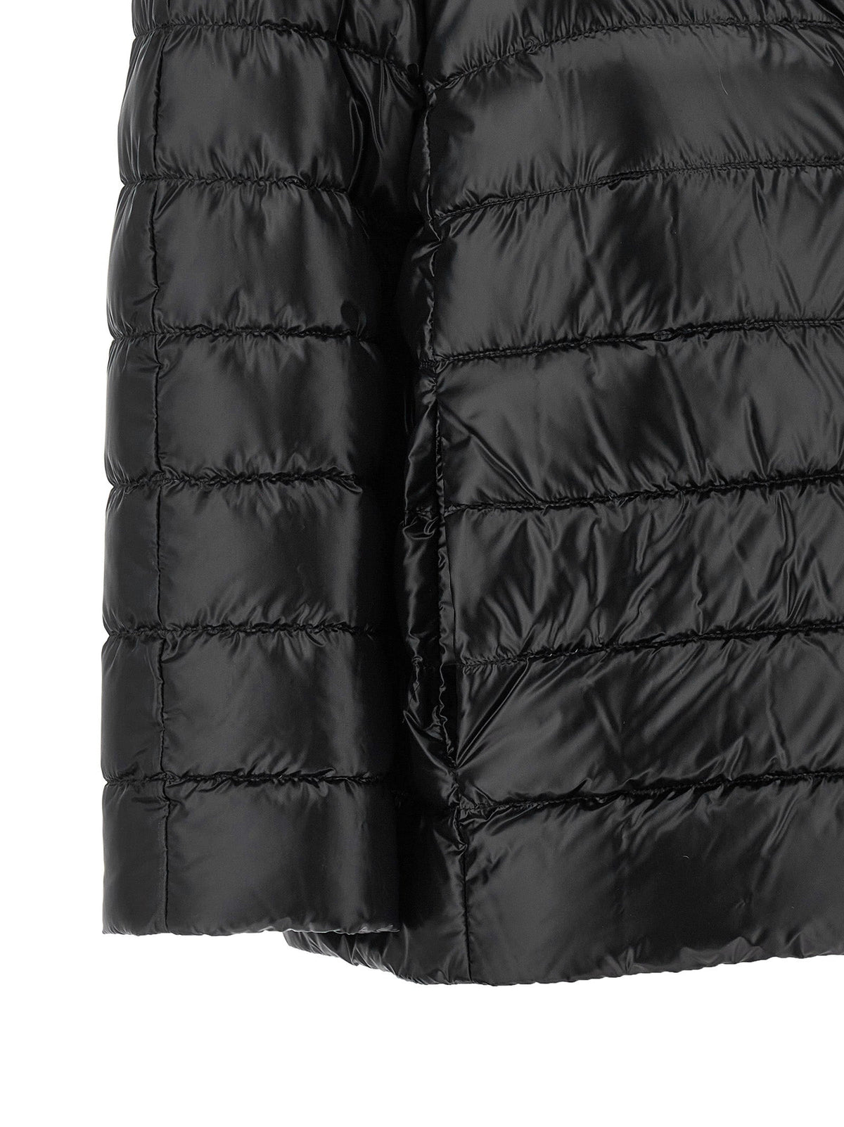 Women’s black quilted puffer jacket close-up of lower hem and stitching