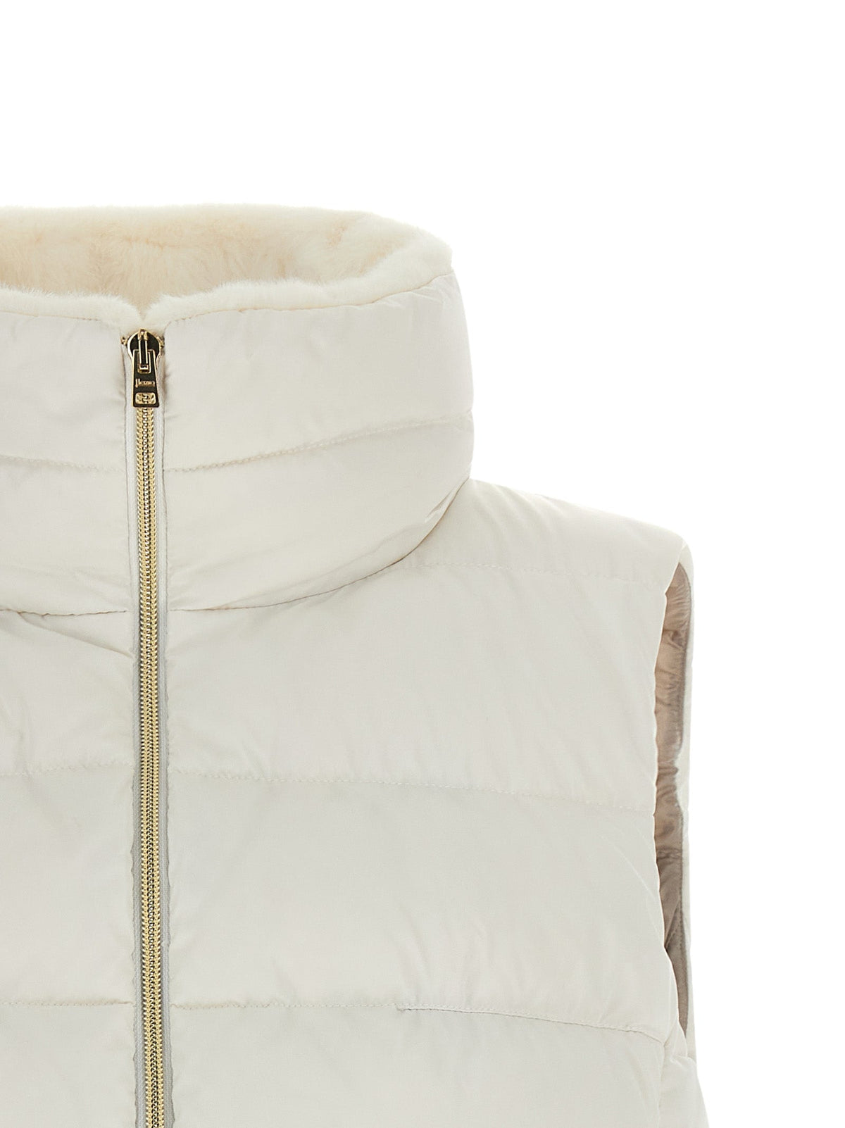 Cream sleeveless puffer vest with front zipper and stitched channel quilting