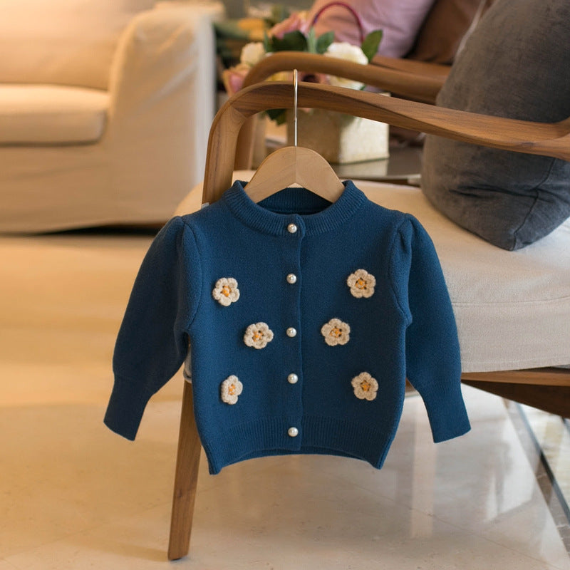 Blue children's cardigan sweater with embroidered flower appliques and button front