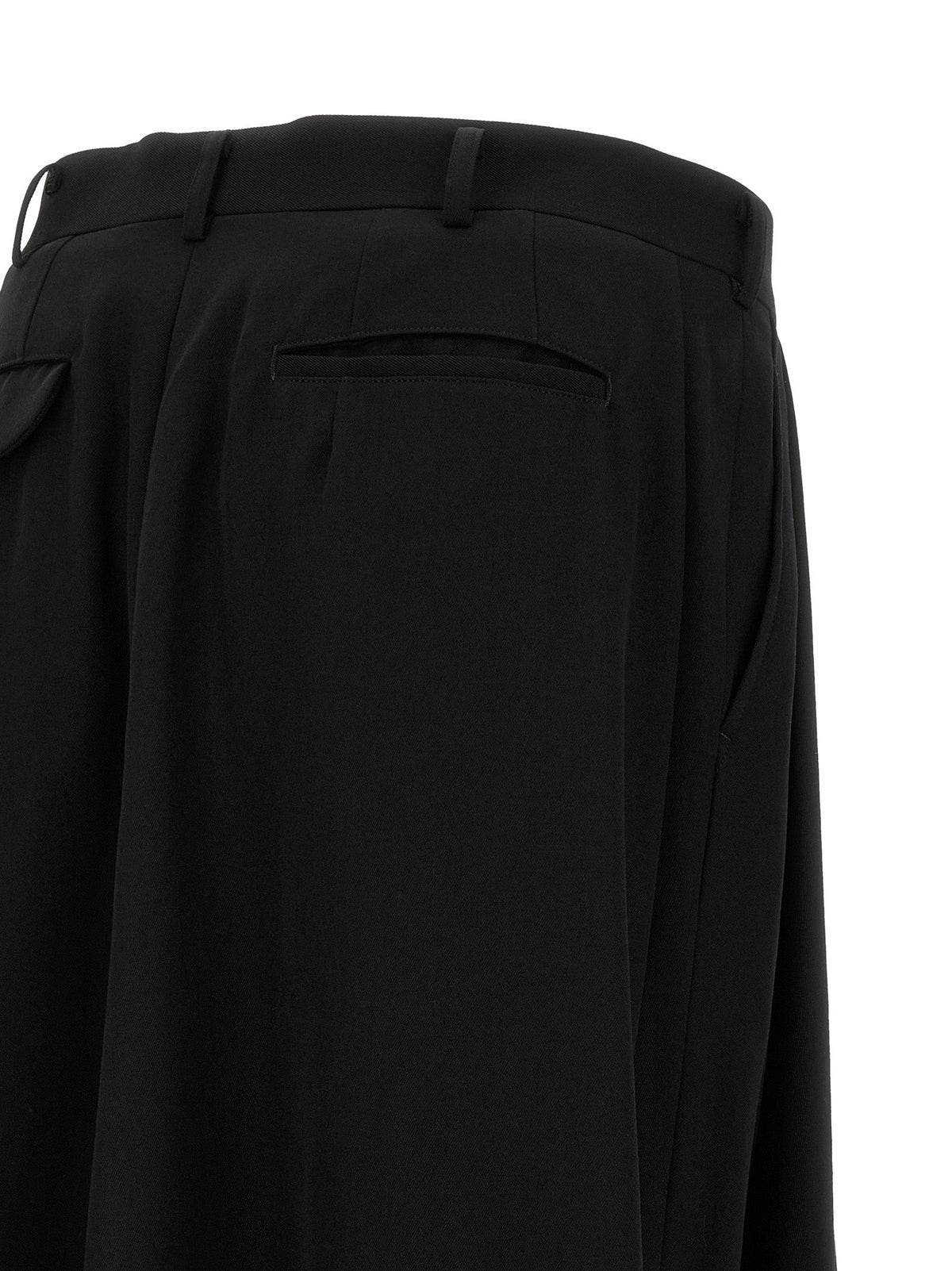 Black wool dress pants with back welt pocket and draped panel