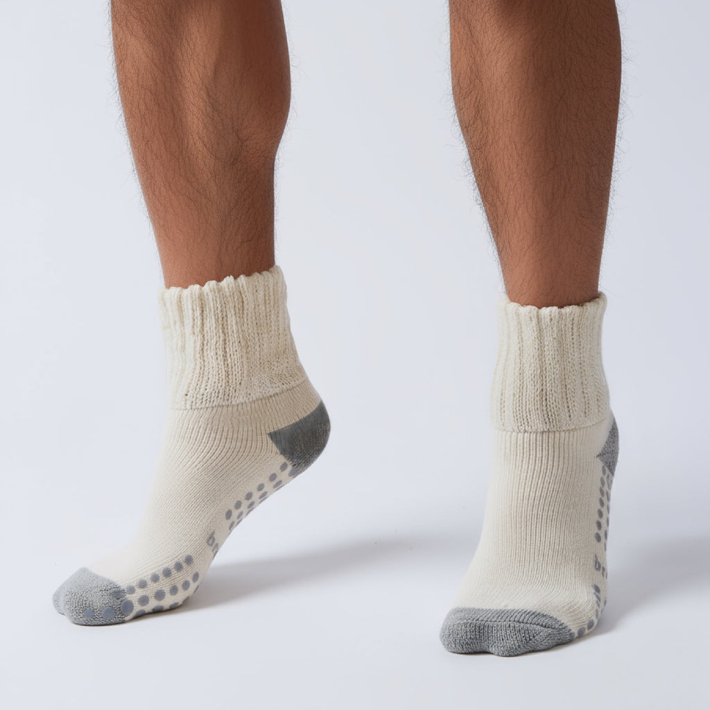 Men's crew socks close-up, ribbed cuff with gray toe and grip dots