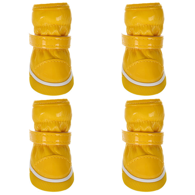 Yellow pet ski boots shown from multiple angles, with white-trim rubber soles and hook straps