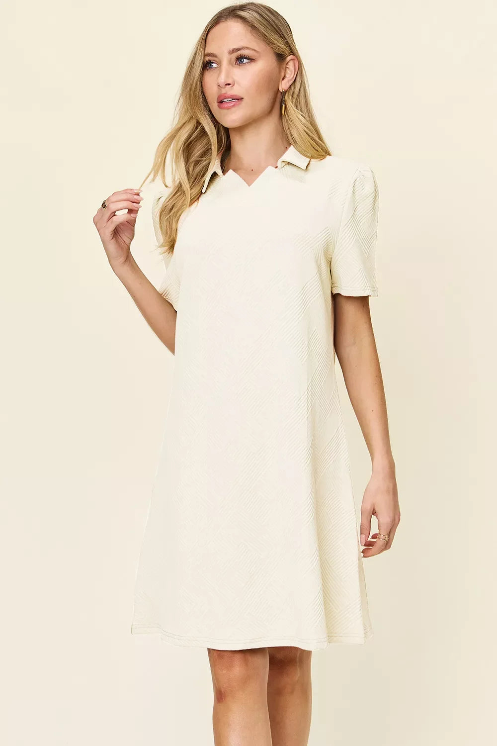 Cream textured collared short-sleeve shift dress with buttoned placket