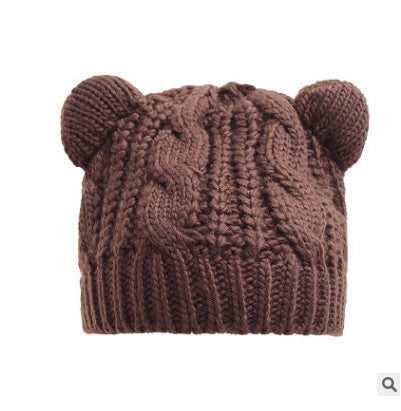 Women’s knitted cat-ear beanie hat, warm brown with thick cable-knit pattern