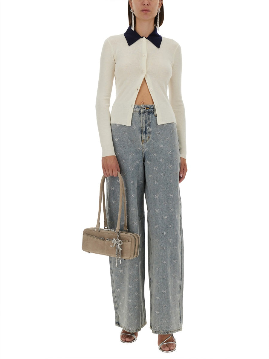 Cream merino wool cardigan with navy collar, button front, slim long-sleeve fit