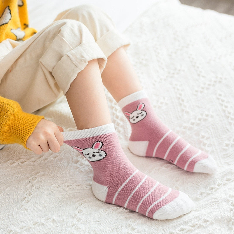 Children's terry socks with pink bunny graphic and white stripe bands on legs